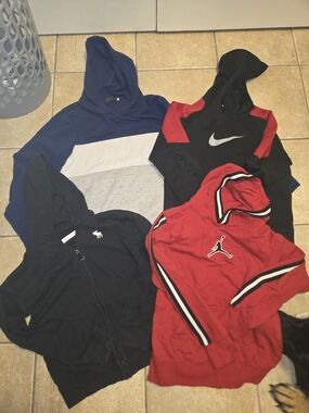 Nike Black Hoodie with Red Shoulder Panels and White Swoosh